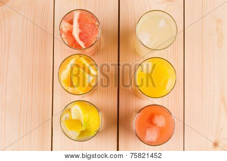 Lemonade orange and grapefruit juice on table.