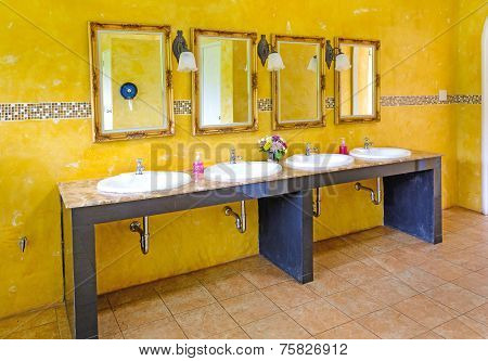 Handbasin And Mirror In Toilet