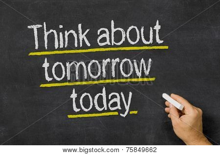 Blackboard with the text Think about tomorrow today
