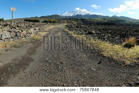 dirt road to the volcano Etna snow covered, Sicily 