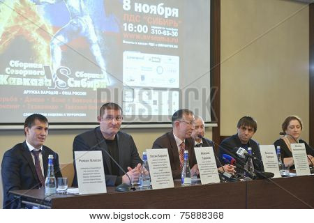 NOVOSIBIRSK, RUSSIA - NOVEMBER 7, 2014: Organizers on the press-conference before the Friendship Cup. Left to right: World champions Roman Vlasov, Hasan Beroyev, Maxim Tarasov, and other