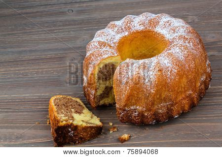 a marble cake for dessert. photo icon for taxes, duties and shares