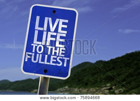 Live Life to the Fullest sign with a beach on background