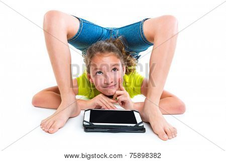 Flexible contortionist kid girl thinking gesture with tablet pc on white background