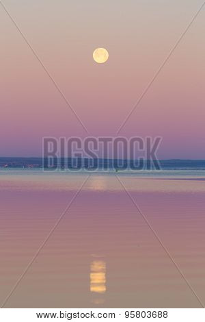 Moon Setting Over Sea.