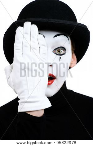 Portrait of a male mime artist. Isolated over white.