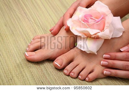 Beautiful feet with perfect spa french nail pedicure