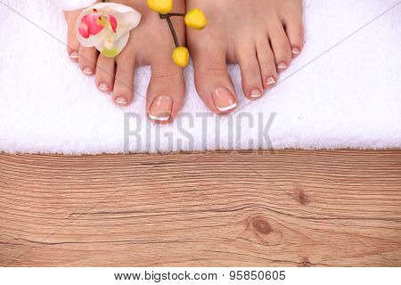 Beautiful feet with perfect spa french nail pedicure