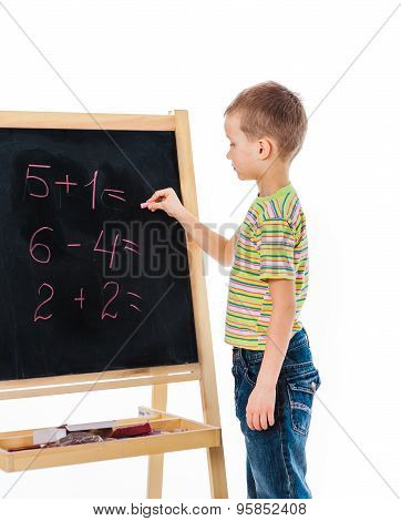 Boy answering some math exercise