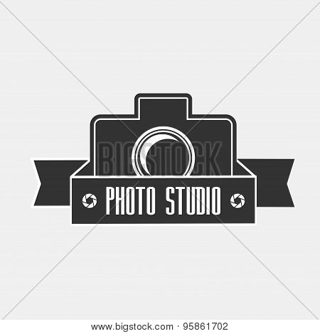 Photo Studio Vector Logo Illustration In Vintage Style With Ribbon And Photo Camera.