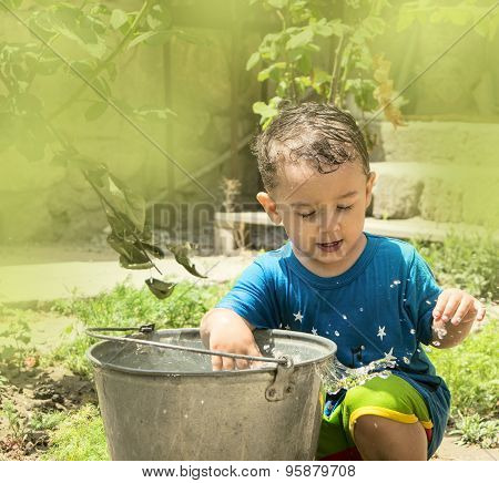 A Boy Plays With Water