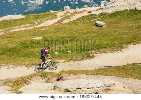 Bucegi Mountains, Romania July 09, 2015: Unidentified Biker Climbs The Hill In Bucegi Mountains In R