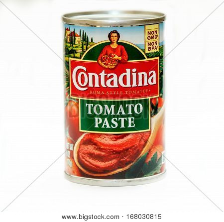 New York January 23 2017: A can of Contadina tomato paste against white background.