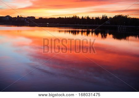 Beautiful romantic sunset over a calm lake
