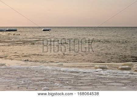 View of the sunset of the Baltic Sea in the winter.