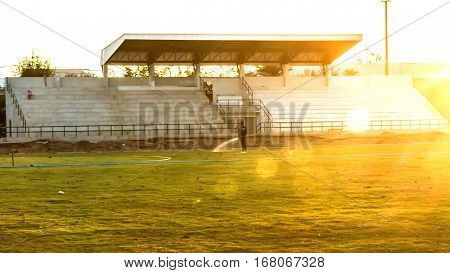 A football field Davao goodbye to the sun goes down. Golden splendor of the picture on the right.