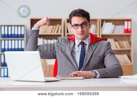 Superhero businessman working in the office