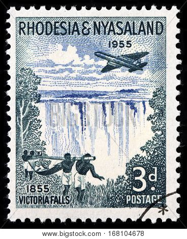 LUGA RUSSIA - SEPTEMBER 18 2015: A stamp printed by RHODESIA AND NYASALAND shows beautiful view of Victoria falls - a waterfall in southern Africa on the Zambezi River circa 1955