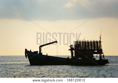 Cargo Ship. Silhouette of cargo ship. The silhouette of the ship