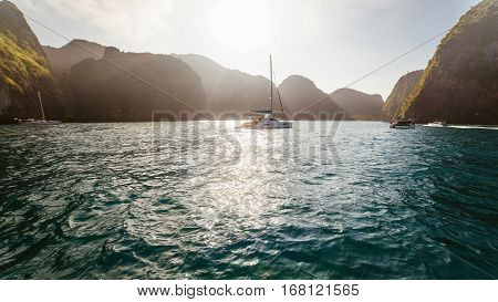 Yacht at sunrise. Yacht at dawn with mountains in the background