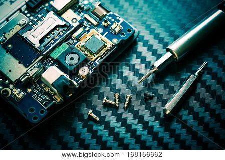 Computer Hard Drive Repair Closeup Photo. Carbon background.
