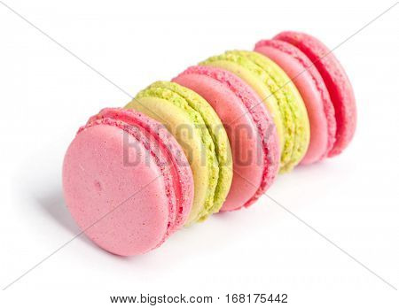 Tasty macaroons in two colors isolated on white background