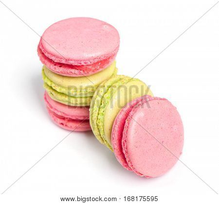 Tasty macaroons in two colors isolated on white background