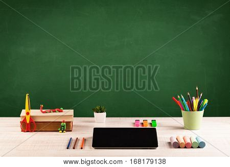 Back to school concepty with clear blackboard background, desk, items
