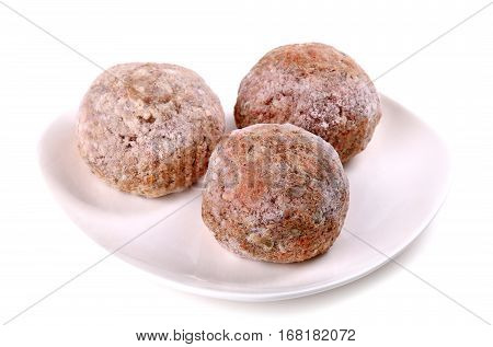 Frozen Ground Meat On A White Plate