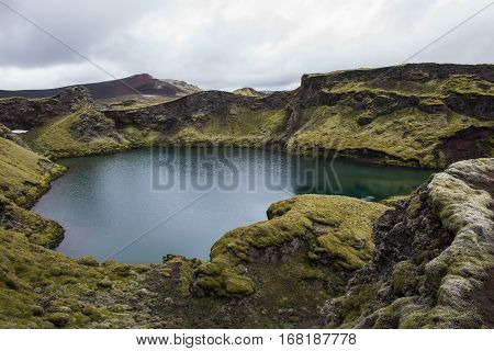 green Laki crater lake Tjarnargigur on Iceland