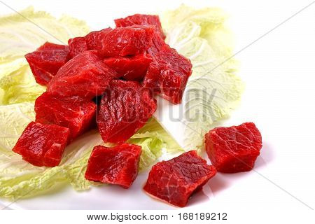 Raw Sliced Meat On A Cabbage Leaf