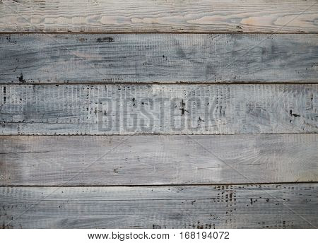 The surface of the rough planks painted light paint. Background