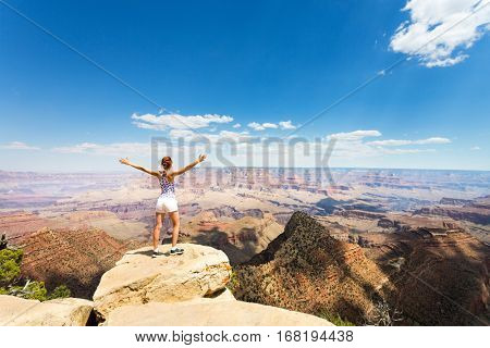 Female tourist look at Grand Canyon landscape