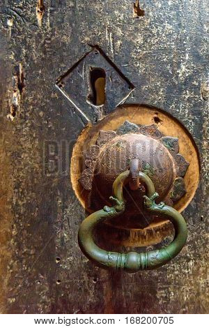Antient door handle at gates of cave temple in Dambulla, Sri Lanka