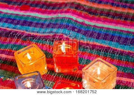 red yellow orange white  blue candle .