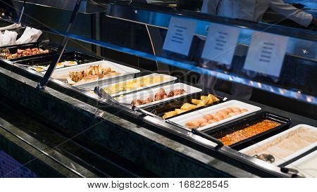 self-service buffet with full breakfast - bacon fried and scrambled eggs fried sausages potato naggets boiled eggs toasts porridge etc