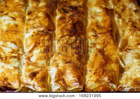 Homemade sliced pie with pumpkin and plums. Traditional eastern food