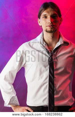 Masculinity fashion party concept. Man in shirt and tie. Young long haired male on bright colorful background.