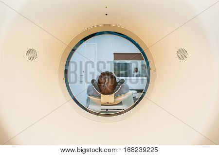 Close Up Patient At Ct Scan Tomography In Hospital, Shot Through The Tube Of Device. Selective Focus