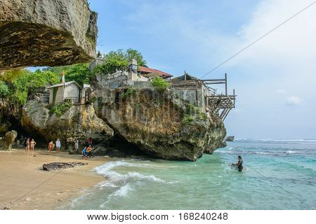 Uluwatu beach, Bali, Indonesia - October 2, 2016: Surfers on the Uluwatu beach