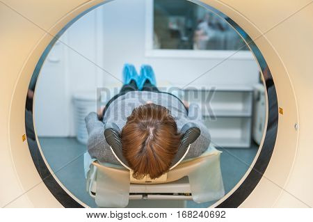 Close Up Patient At Ct Scan Tomography In Hospital, Shot Through The Tube Of Device. Selective Focus