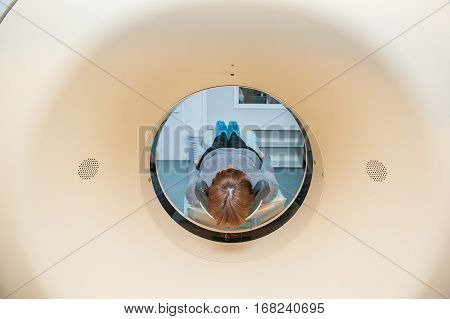 Close Up Patient At Ct Scan Tomography In Hospital, Shot Through The Tube Of Device. Selective Focus