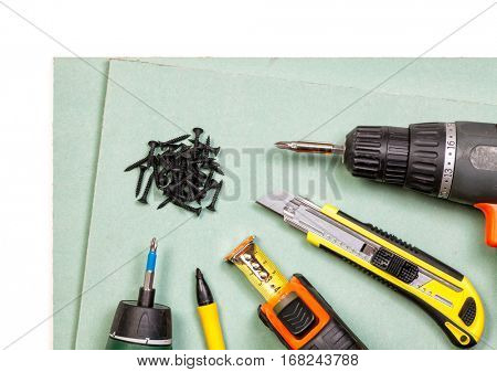 Plasterboard tools set with screws, tape measure, screwguns cutter and marker pen
