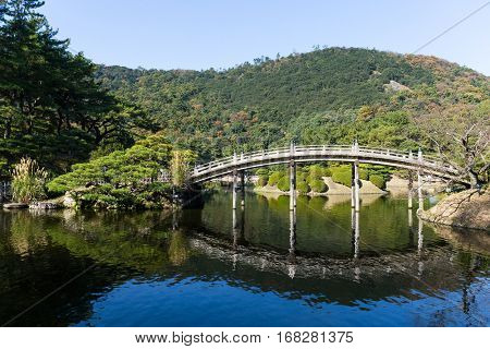 Traditional Ritsurin Garden and wooden bridge