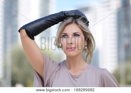 beautiful young woman posing outdoors 