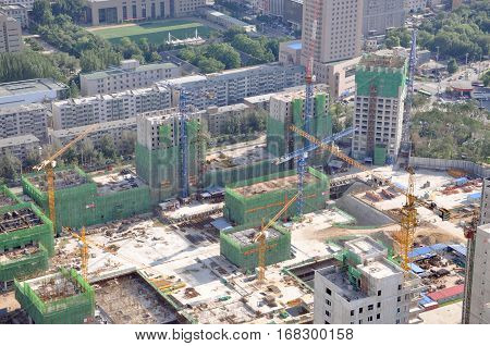 SHENYANG, CHINA - JUL. 29, 2012: Cranes in Construction Site in City of Shenyang, Liaoning Province, China. Photo taken from the top of Liaoning Broadcast and TV Tower, downtown Shenyang, China.