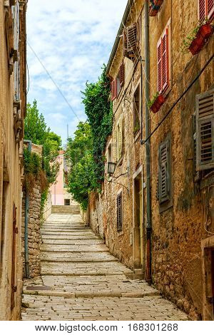Cozy and narrow streets in Pula's medieval old town Croatia