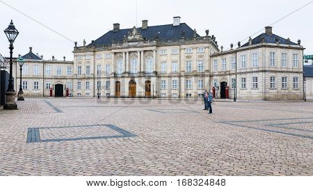 COPENHAGEN DENMARK - SEPTEMBER 10 2011: royal Moltke's Palace in Amalienborg of Copenhagen city in autumn day. Amalienborg is the home of the Danish royal family.