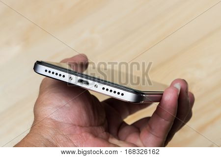 bottom of smartphone sound port and microUSB port for charger.
