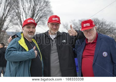 WASHINGTON DC - JANUARY 20: Men with slogan hats during Inauguration of Donald Trump. Taken January 20 2017 in District of Columbia.